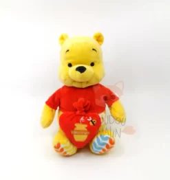 Disney - Winnie L'ourson - Peluche Musicale Coeur Rouge Jaune 25 Cm